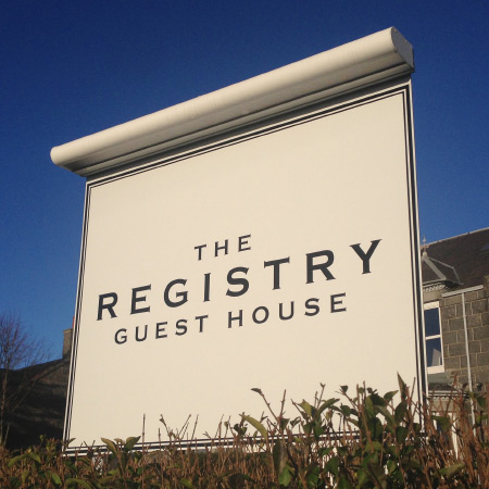 The Registry Guest House sign